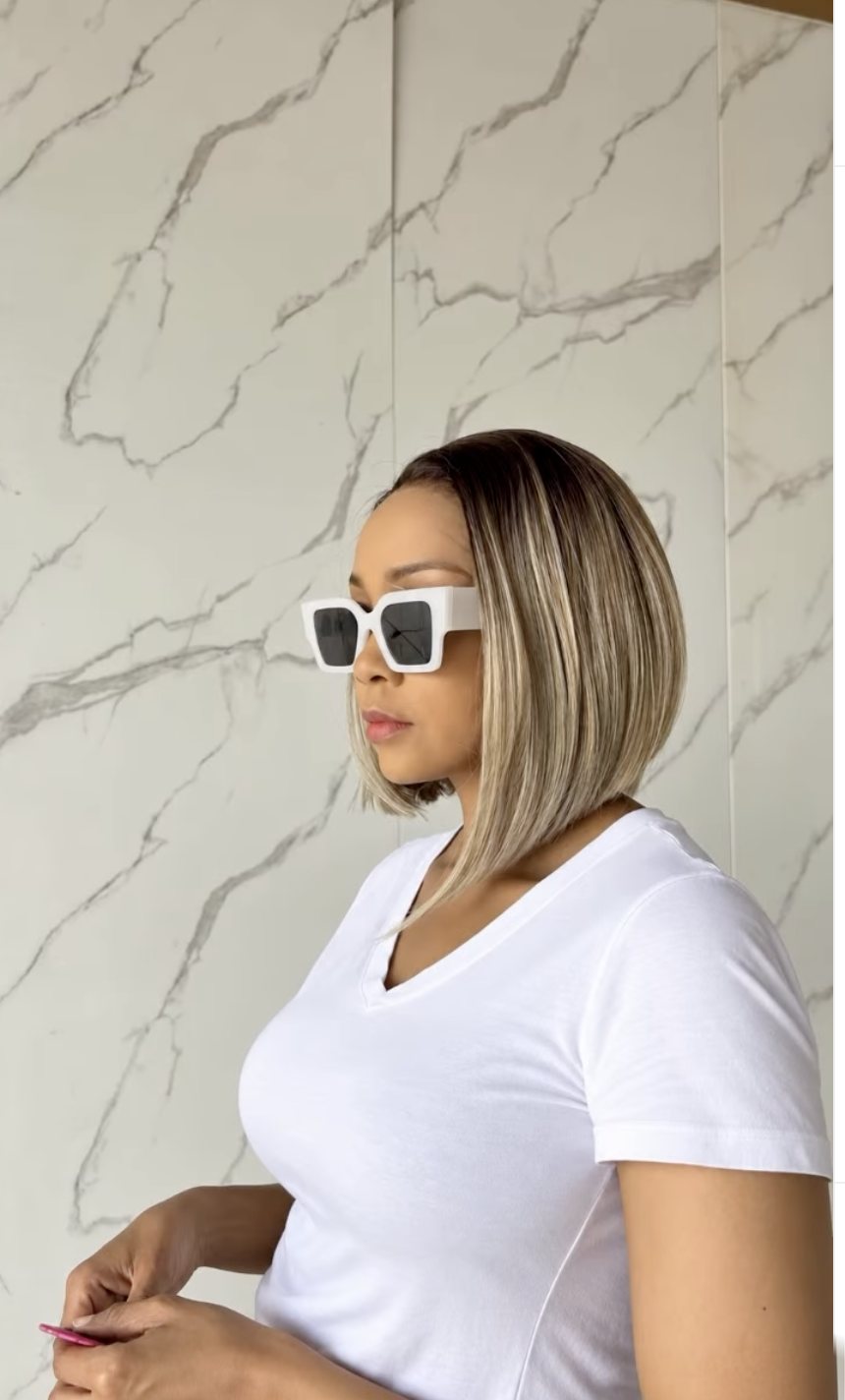 Model wearing a sleek straight bob human hair blend wig